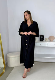 GRETA GŁADKA SUKIENKA PLUS SIZE Z ROZKLOSZOWANYM DOŁEM I GUZIKAMI. CZARNA 01 image 5