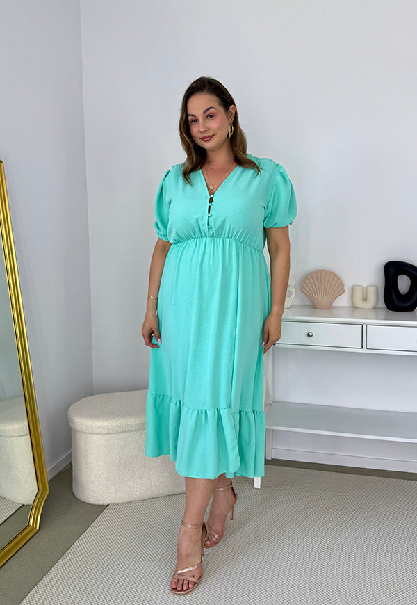 AMANDA GŁADKA MAXI PLUS SIZE SUKIENKA Z KRÓTKIMI RĘKAWAMI PRZED DŁUGA Z GUZIKAMI. MIETOWA 03 image 4